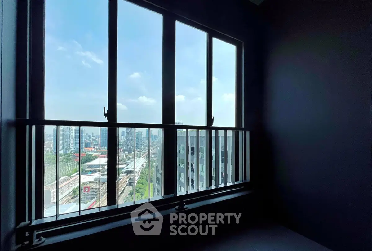 Stunning city view from a modern apartment window, perfect for urban living.