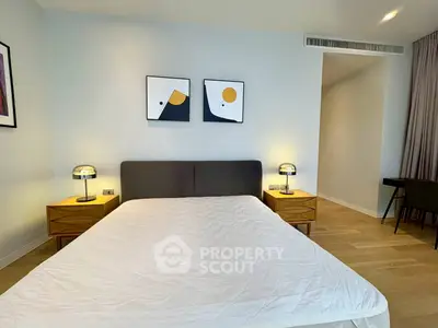 Modern bedroom with stylish decor and wooden flooring