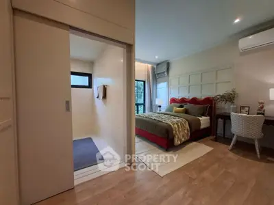 Modern bedroom with ensuite bathroom and stylish decor