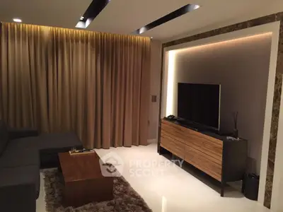 Modern living room with sleek TV setup and elegant lighting