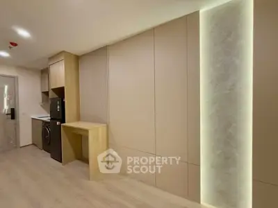 Modern kitchen with sleek cabinetry and integrated appliances