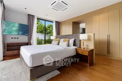 Luxurious bedroom with modern design, large window, and elegant wooden flooring.
