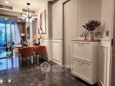 Luxurious modern apartment interior with elegant dining area and stylish decor, featuring marble flooring and contemporary art.