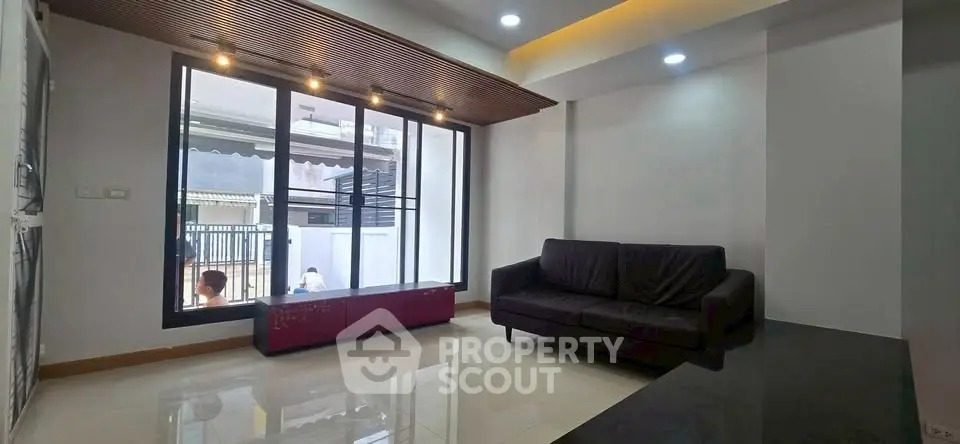 Modern living room with sleek design and large window
