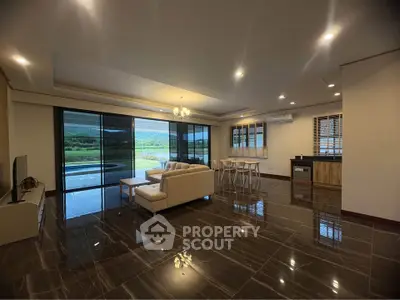 Spacious modern living room with open layout and stunning view, perfect for luxury living.