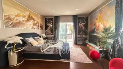 Luxurious bedroom with elegant decor and balcony access, featuring artistic wall designs and cozy furnishings.