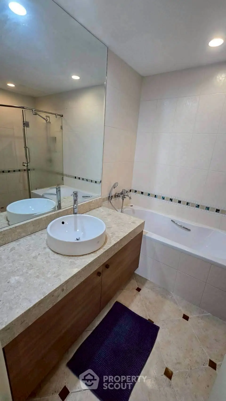 Modern bathroom with elegant fixtures and spacious bathtub, featuring a sleek design and calming ambiance.