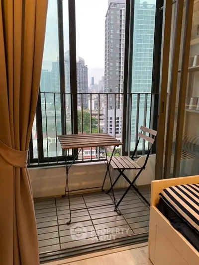 Charming urban balcony with city view, perfect for relaxation and enjoying the skyline.