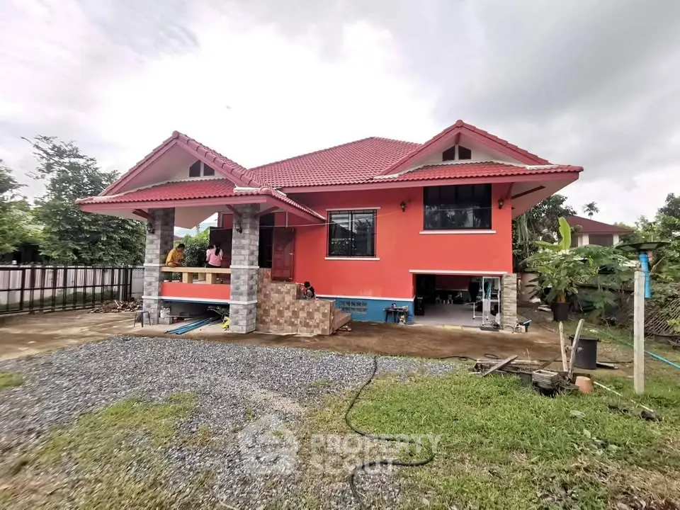 Charming single-story house with red roof and spacious front yard