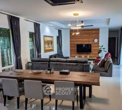 Spacious modern living room with elegant dining area and stylish decor