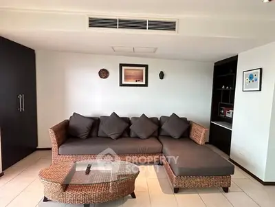 Stylish living room with modern wicker sofa and elegant decor