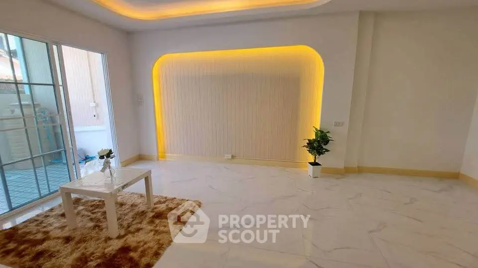 Modern living room with stylish lighting and marble flooring