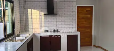 Modern kitchen with gas stove and sleek cabinetry