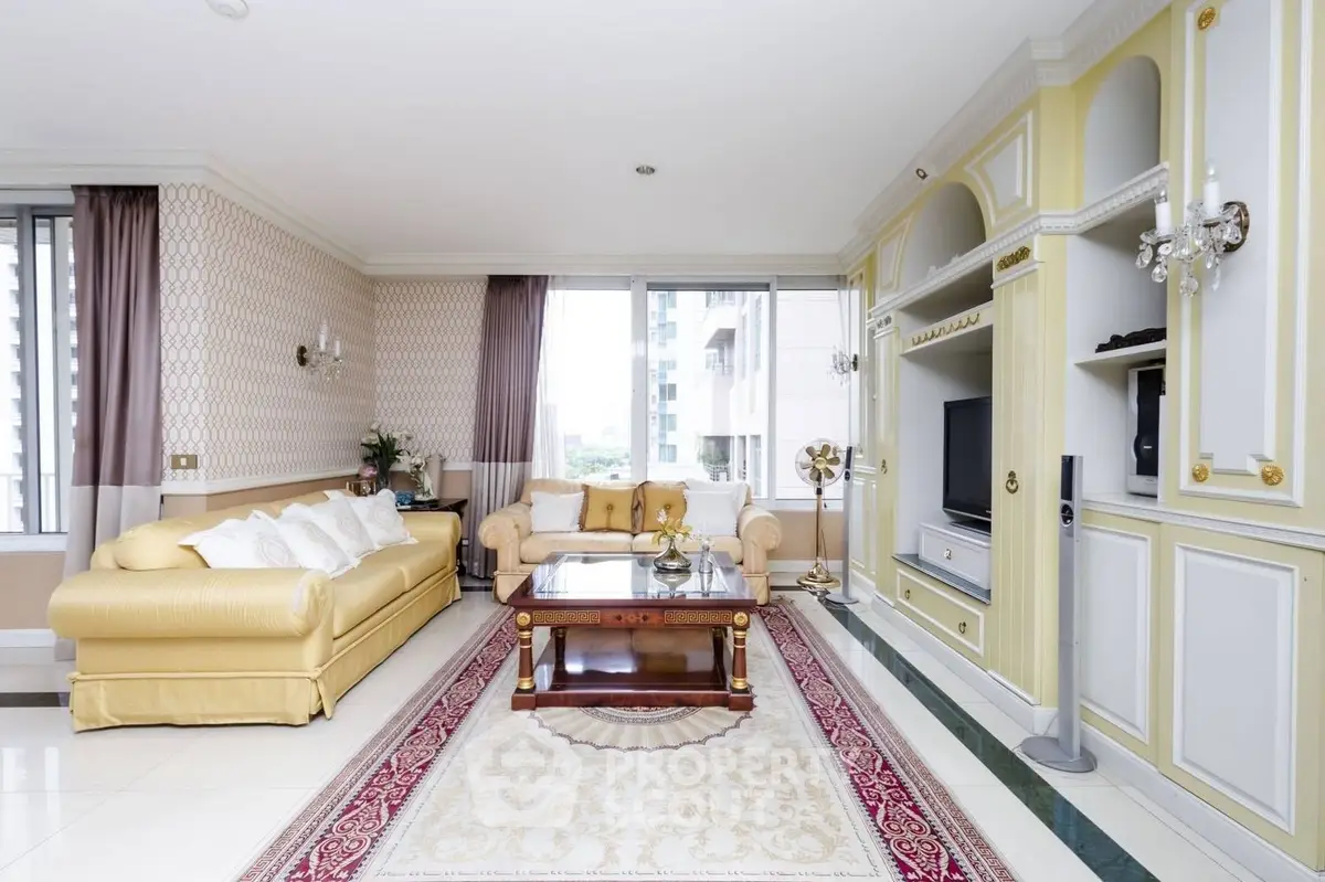 Luxurious living room with elegant decor and large windows offering a stunning city view.