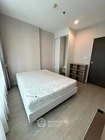 Modern bedroom with minimalist design and ample natural light