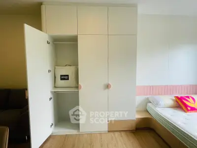 Modern bedroom with built-in wardrobe and stylish bed design