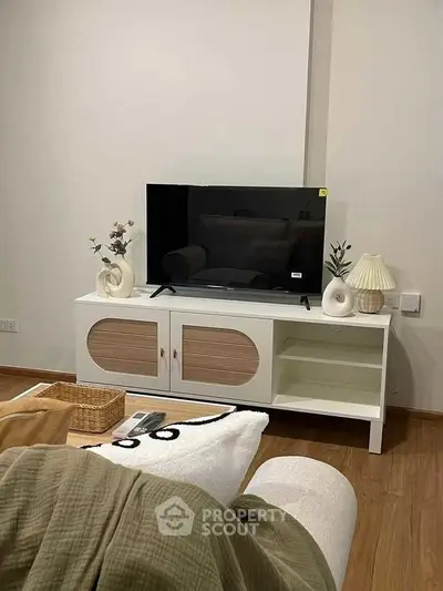 Modern living room with stylish TV stand and cozy decor