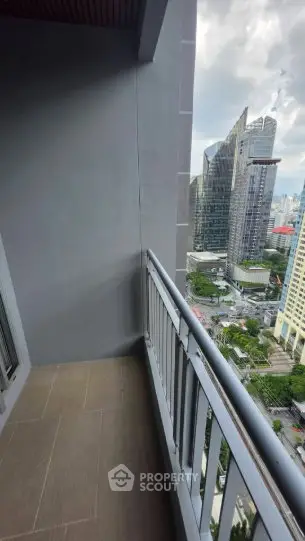 Stunning city view from a modern high-rise balcony, perfect for urban living.