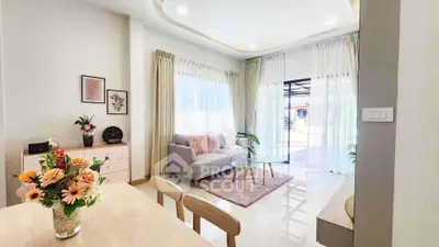 Bright and airy living room with modern decor and large windows