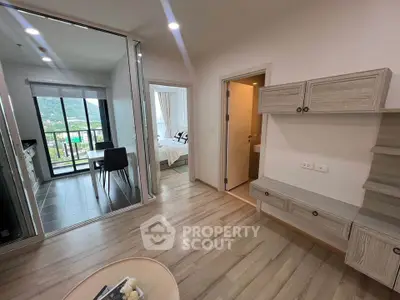 Modern apartment interior with open layout, featuring a cozy bedroom and scenic balcony view.