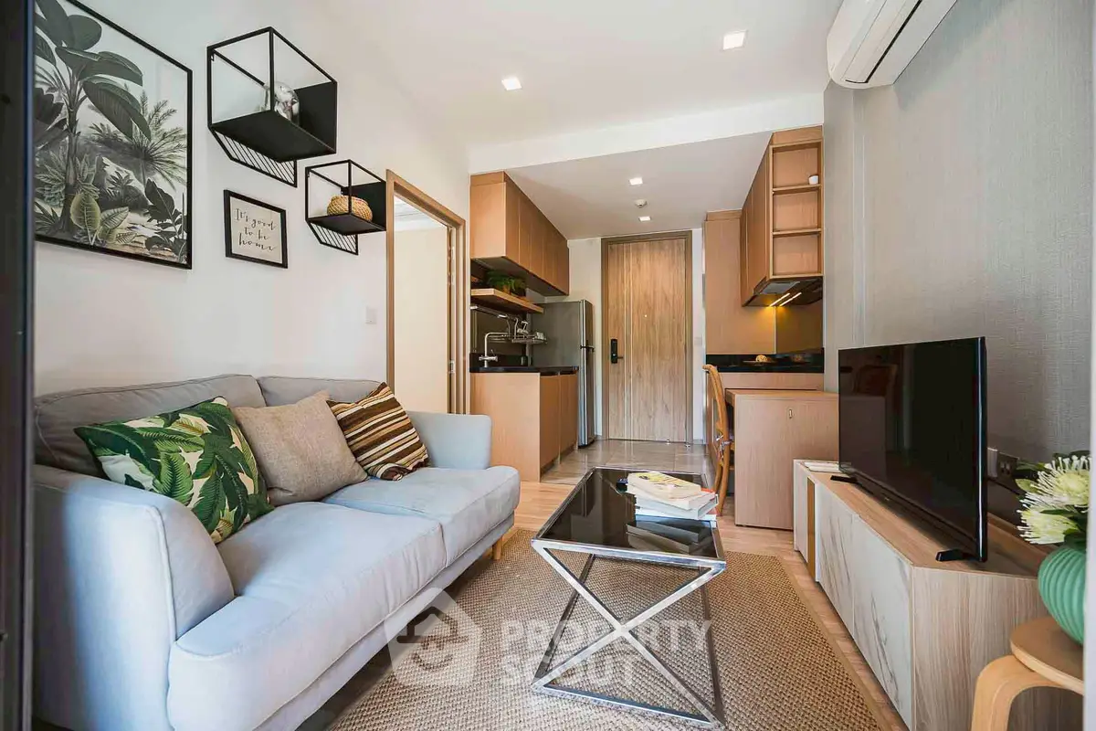 Modern living room with stylish decor and open kitchen layout, perfect for urban living.
