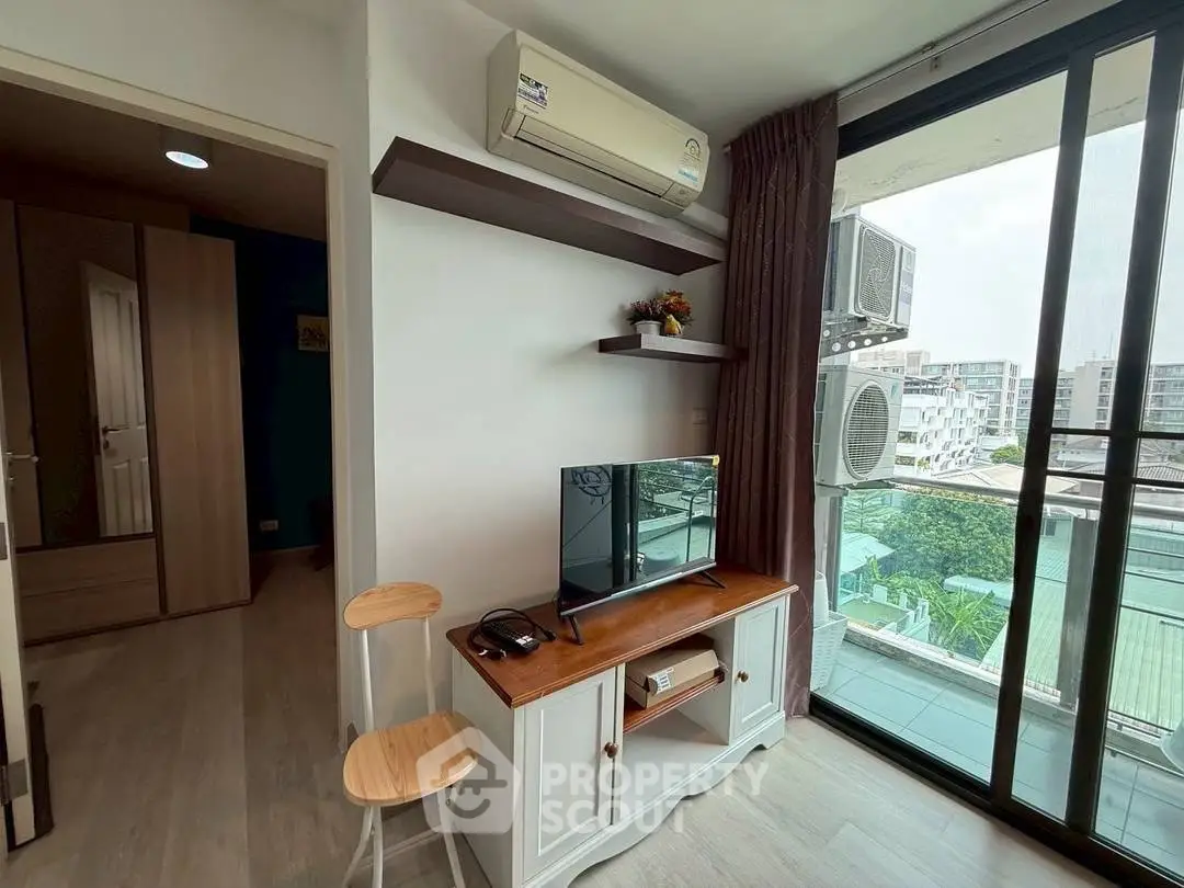 Modern living room with balcony view and air conditioning