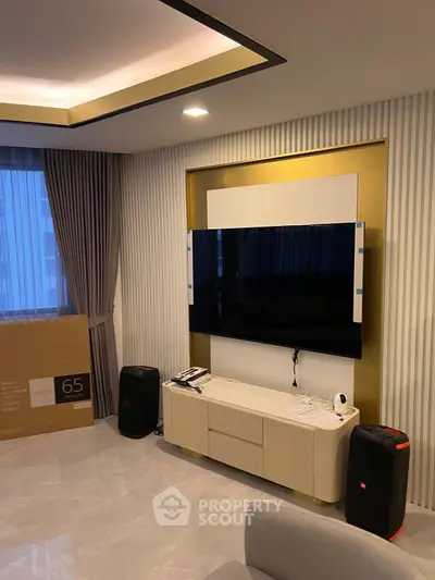 Modern living room with sleek TV setup and elegant decor