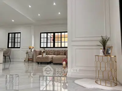 Luxurious living room with elegant decor and plush seating in a modern home.