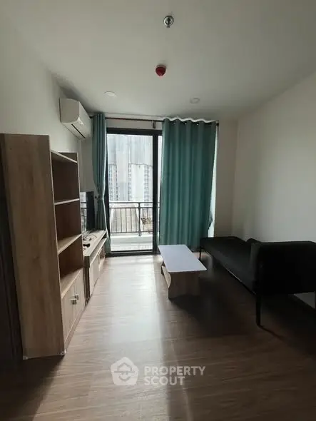 Modern living room with balcony access and stylish furniture