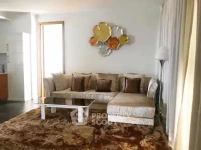 Luxurious living room with plush sofa and elegant decor, perfect for relaxation and entertainment.