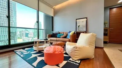 Modern living room with city view, stylish furniture, and large windows.