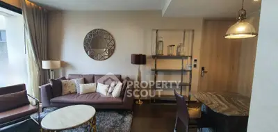 Modern living room with stylish decor and elegant furniture in a cozy apartment setting.