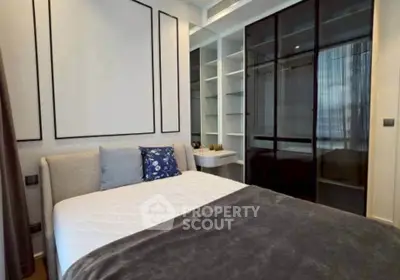 Modern bedroom with stylish decor and ample storage space