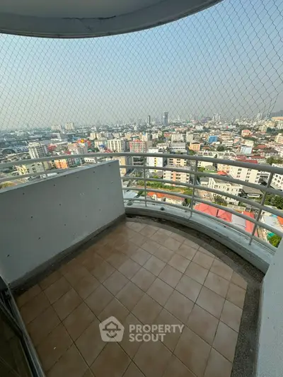 Stunning high-rise balcony with panoramic city views, perfect for urban living.