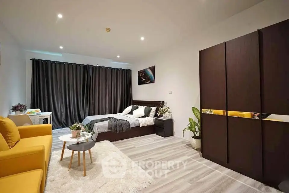 Spacious modern bedroom with stylish decor and cozy ambiance