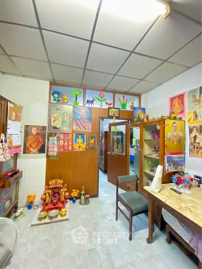 Charming study room with cultural decor and vibrant wall art