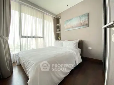 Bright and cozy bedroom with large windows and elegant decor