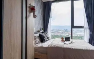 Cozy bedroom with stunning city view and modern decor