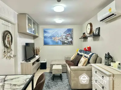 Cozy living room with modern decor and wall-mounted TV, perfect for relaxation and entertainment.