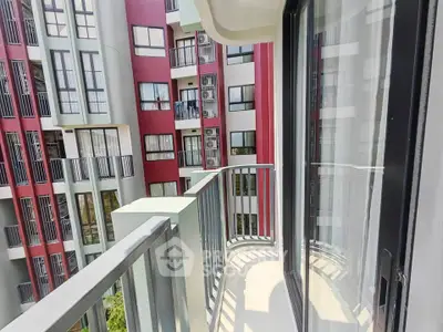 Modern apartment balcony with sleek railing and city view