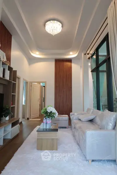 Luxurious living room with elegant decor and plush seating in a modern home.