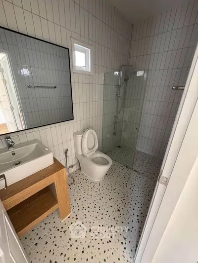 Modern bathroom with glass shower and sleek fixtures