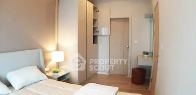 Cozy bedroom with modern furnishings and soft lighting, perfect for relaxation.