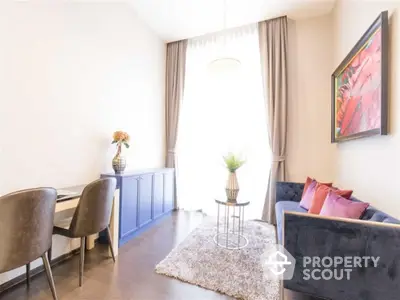 Elegant living room with modern decor, plush sofa, and stylish artwork, perfect for relaxation and entertaining.