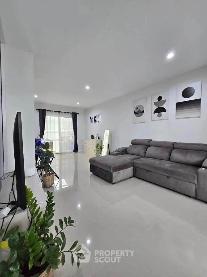 Spacious modern living room with sleek decor and natural light