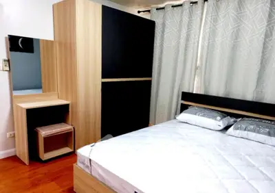 Modern bedroom with stylish wooden furniture and cozy ambiance