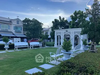 Charming garden with elegant white benches and gazebo in residential area