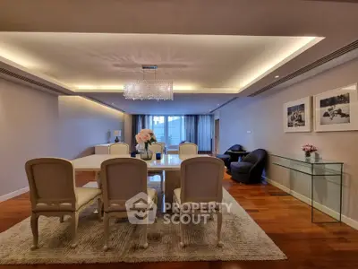 Elegant dining room with chandelier and stylish decor in luxury apartment