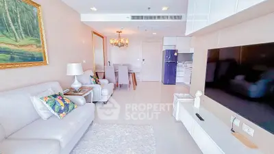 Spacious modern living room with elegant decor and open kitchen layout