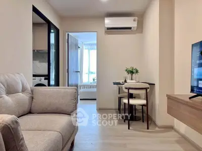 Modern apartment interior with cozy living room and dining area, featuring neutral tones and sleek design.